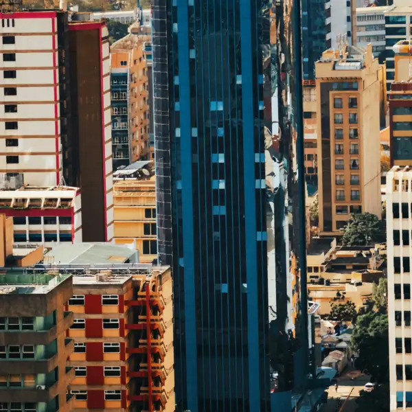 Looking down on tightly packed office towers and a street in a city centre